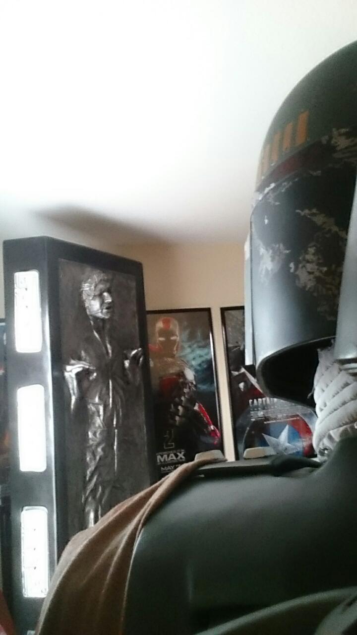 A cool picture of Boba Fett facing the Life-Size Sideshow Han in Carbonite.