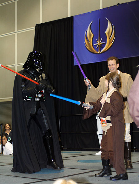 Darth Vader vs. Jedi Padawans at the Jedi Academy.  
Notice the Jedi's one-handed "non-chalant" style of holding the lightsaber! :D