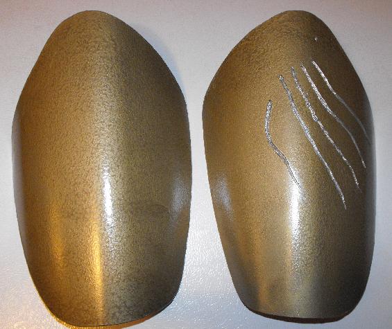 thigh pads of armor. cut from plastic trash can. based on Wizardofflight template!
