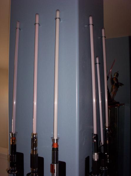 This is the 1st column of the loft, opposite side of the Vader entry. All known Master Replica FX sabers are present. The Darth Maul one is not visible.